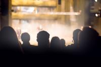 audience in the theater watching a play