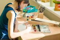 a teen working on art