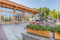 Okotoks Municipal Centre in summer with flowers blooming out front