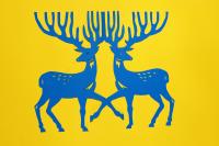 Two blue stags made of paper on a yellow background.