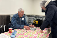 A man and woman prepare to repair an item at a Repair Cafe