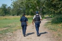 Two peace officers walking in park