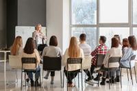 teaching young people in office