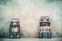 Retro old design boombox on a concrete street wall
