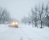 winter snow clearing by plow truck
