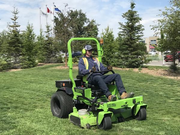 Electric Lawn Mower cutting grass