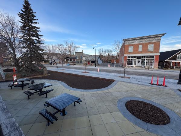 park area with bench seating in downtown okotoks