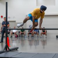 Participant jumps over obstacle in PARE training