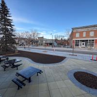 park area with bench seating in downtown okotoks