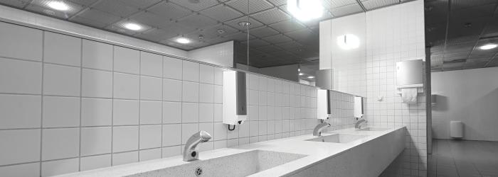 public restroom washroom with automated low flow water faucets