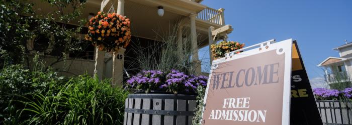 the Okotoks museum from the outside with flowers