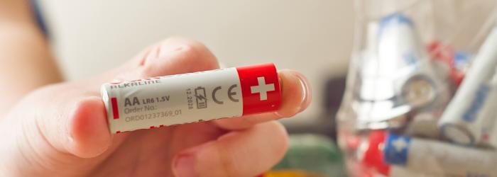 Battery held by a hand