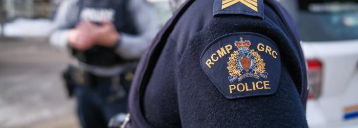 RCMP crest on sleeve of police person