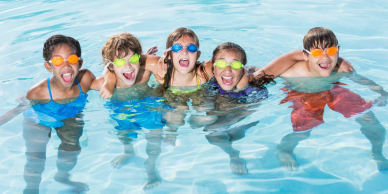 Children laughing in a pool