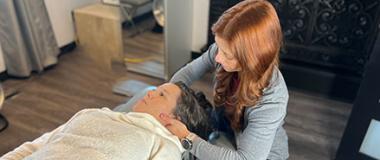 Female chiropractor performing an adjustment on a patient 