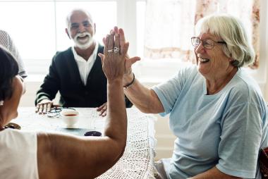 senior high fiving another person 