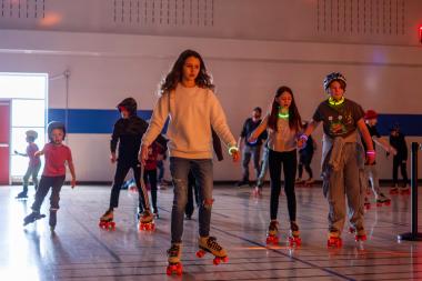 youth roller skating in the gymnasium 