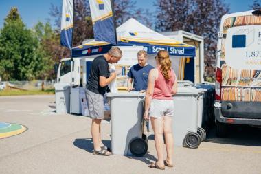 residents dropping off documents for secure shredding. photo credit: Record Express